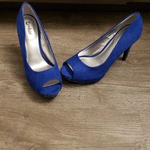 Blue snakeskin heel open toe pumps.